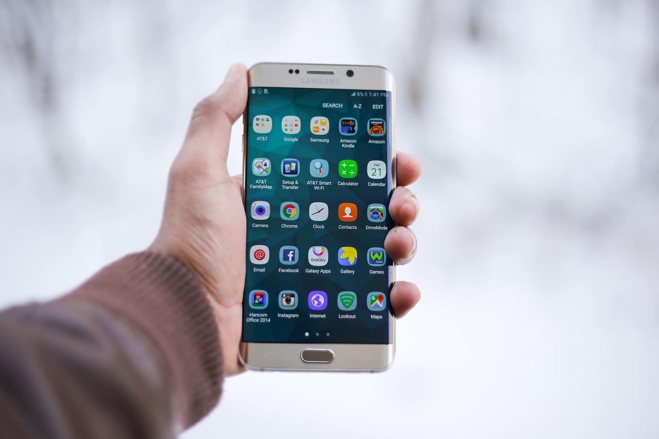 Freelance Bookkeeping & Expense Tracking Guide 4 Mobile phone scanning receipt using digital camera on clean desk